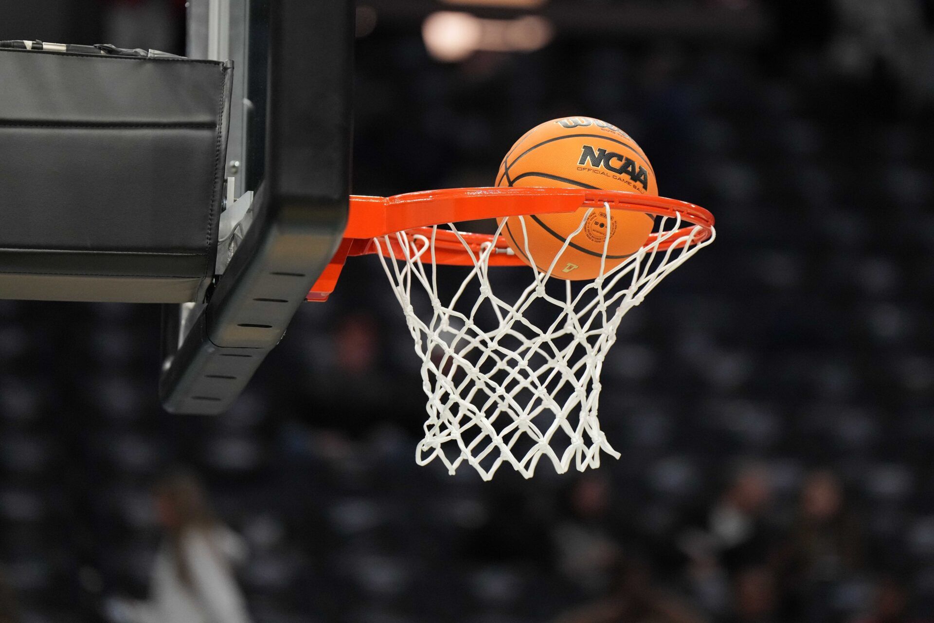 An official Wilson basketball goes through the net and rim at the Final Four championship game of the women's college basketball NCAA Tournament at Target Center.