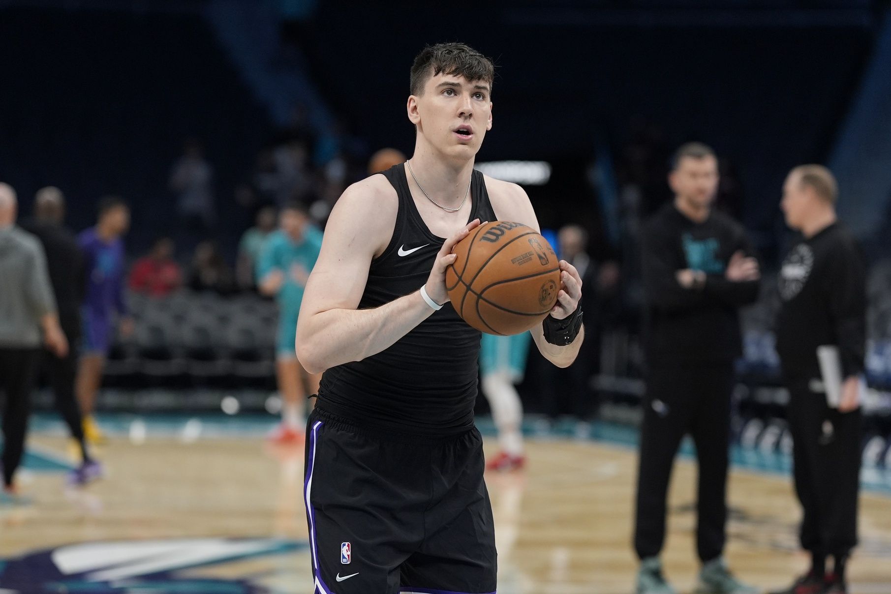 Sacramento Kings forward Jake LaRavia (33) shoots during pregame warm ups against the Charlotte Hornets  at Spectrum Center.