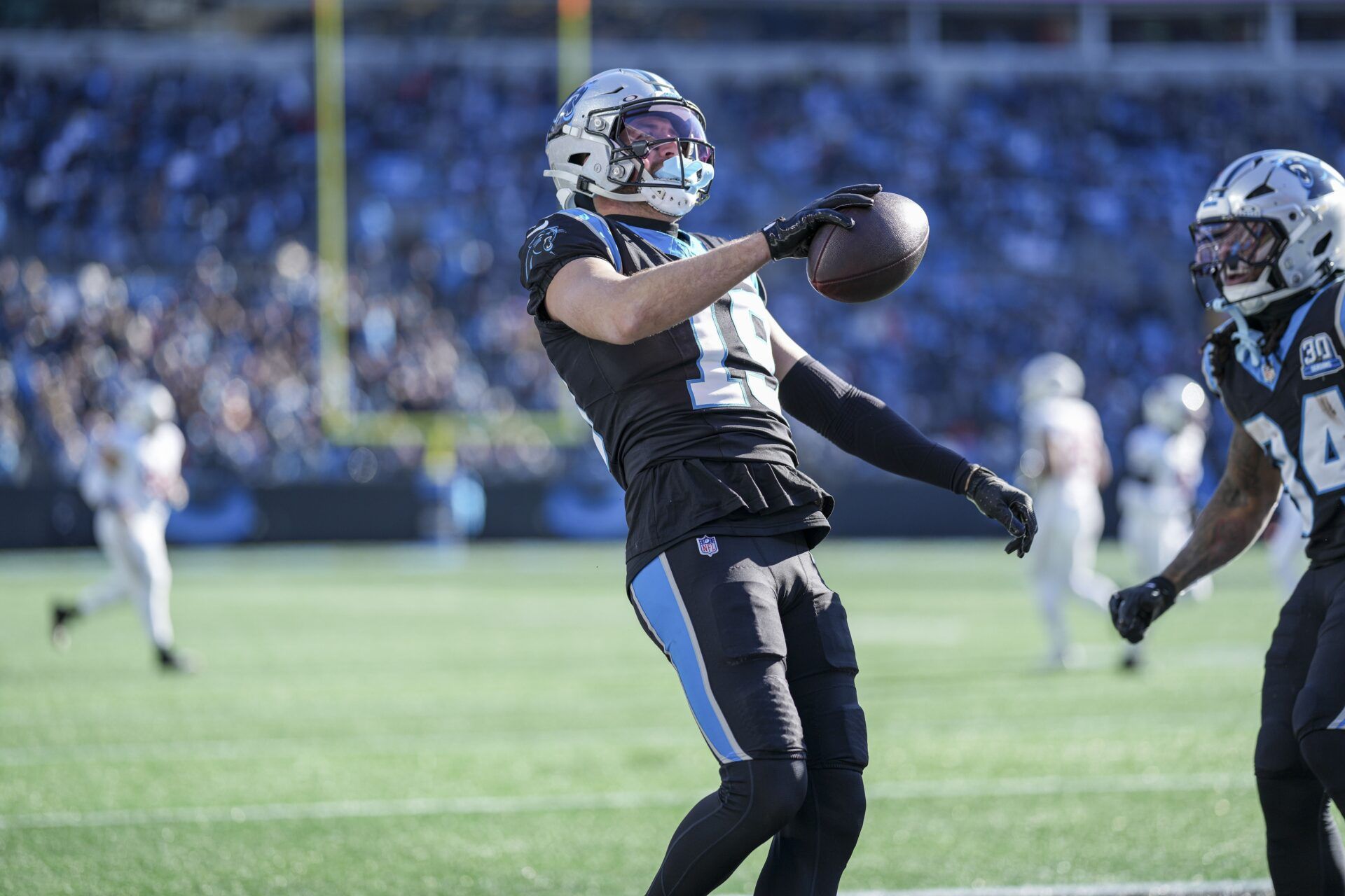 Carolina Panthers wide receiver Adam Thielen (19) reacts to his touchdown catch against the Arizona Cardinals during the second quarter at Bank of America Stadium.