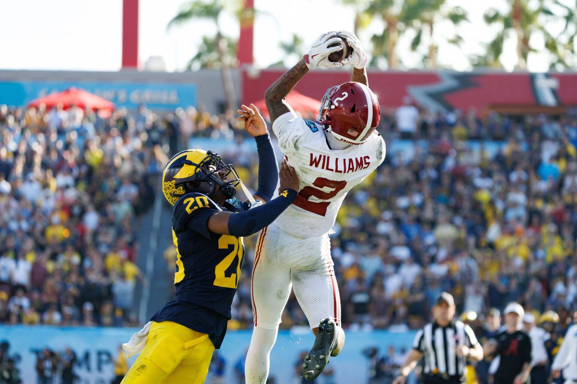 Alabama Crimson Tide wide receiver Ryan Williams (2) makes a catch while Michigan Wolverines defensive back Jyaire Hill (20) pushes him out of bounds during the second half at Raymond James Stadium.