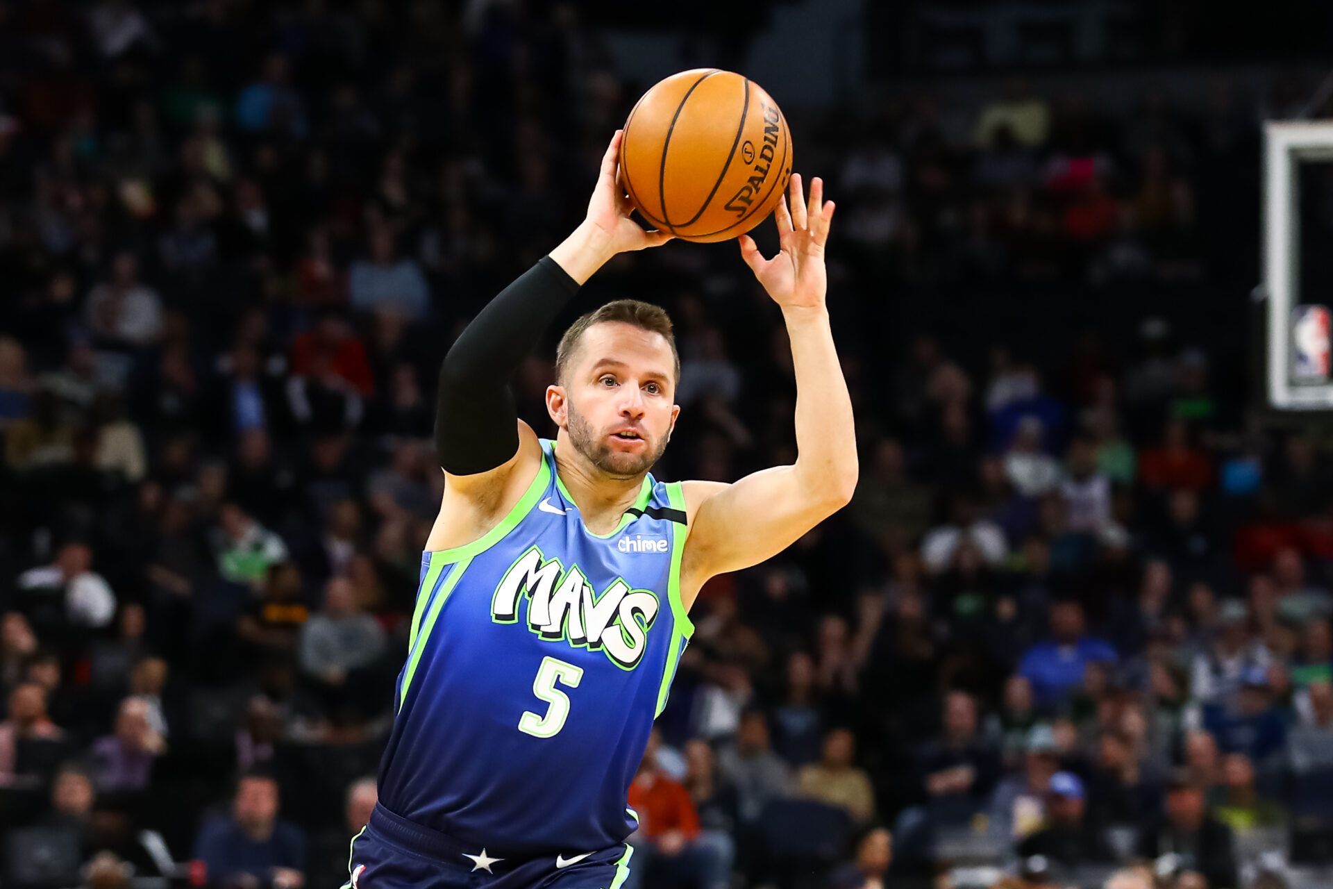 Dallas Mavericks guard J.J. Barea (5) passes the ball against the Minnesota Timberwolves in the first quarter at Target Center.