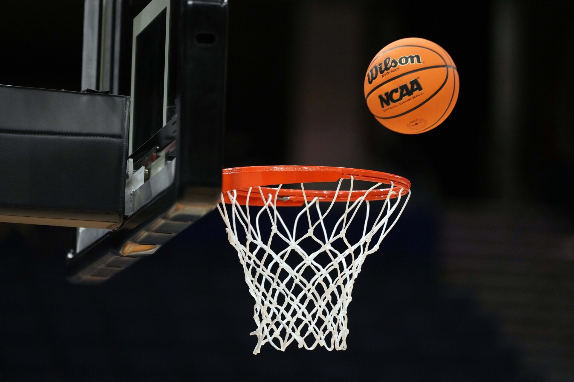 A Wilson EVO Nxt basketball ball with the 2025 NCAA Women's Final Four logo approaches the rim and the net at Amalie Arena.