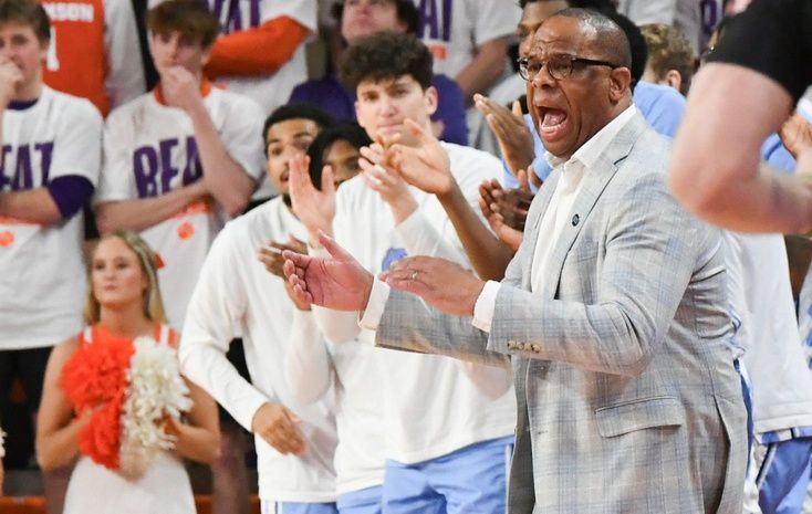 University of North Carolina Head Coach Hubert Davis communicates with players in the game with Clemson during the first half Monday, Feb 10, 2025; Clemson, South Carolina, USA; at Littlejohn Coliseum.