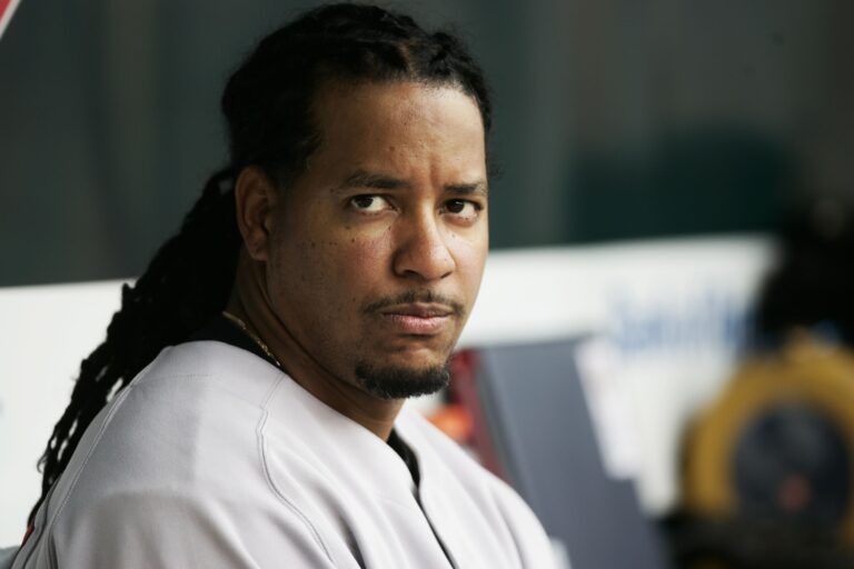 Boston Red Sox left fielder Manny Ramirez (24) sits in the dugout during the game against the Baltimore Orioles at Camden Yards.  Boston won 9-4.