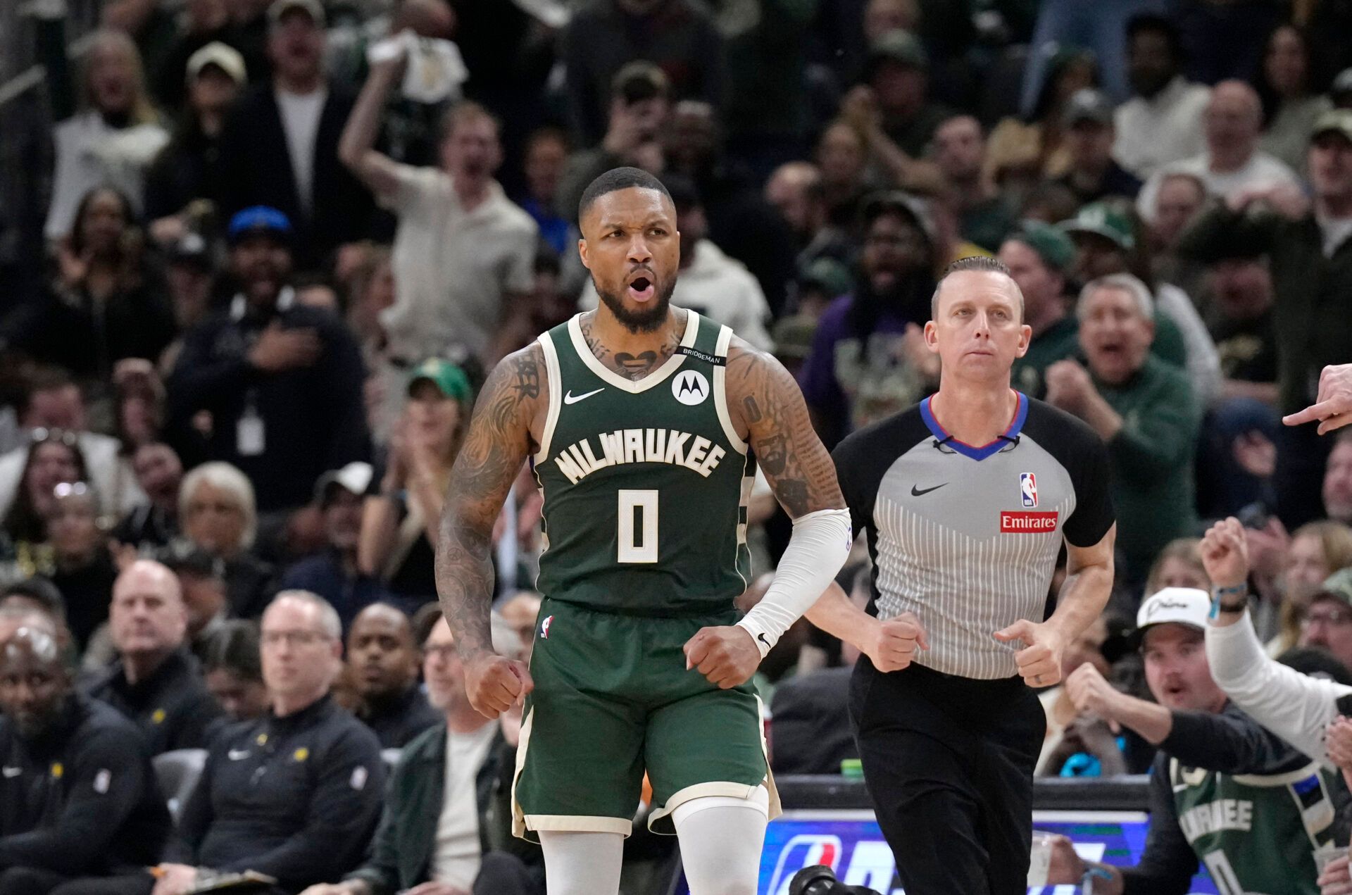 Milwaukee Bucks guard Damian Lillard (0) reacts after making a basket against the Indiana Pacers in the second half during game three of first round for the 2024 NBA Playoffs at Fiserv Forum.
