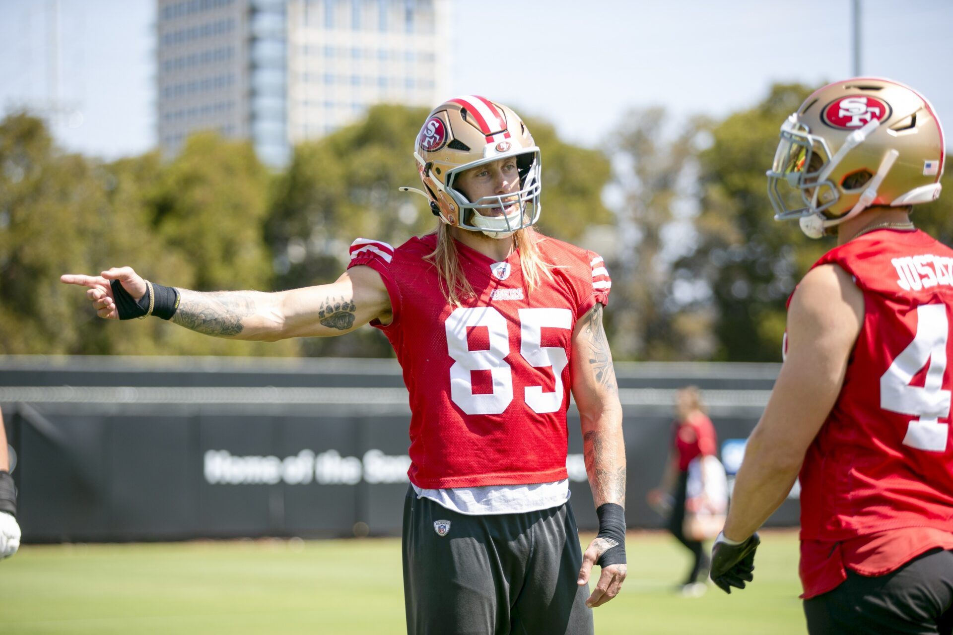 San Francisco 49ers tight end George Kittle (85) jokes with fullback Kyle Juszczyk (44) during a team OTA at Levi's Stadium.