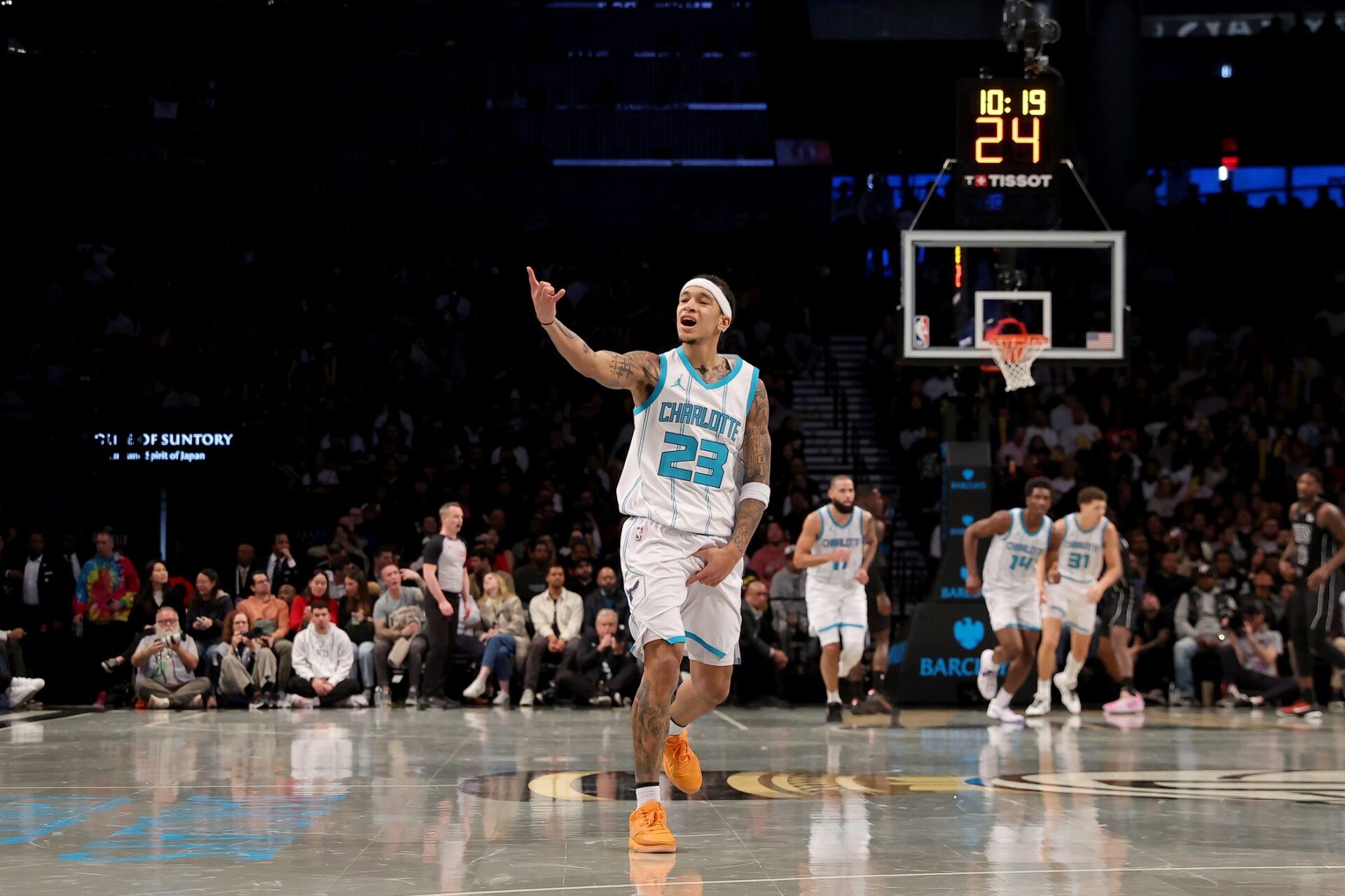 Charlotte Hornets guard Tre Mann (23) celebrates his three point shot against the Brooklyn Nets during the fourth quarter at Barclays Center.