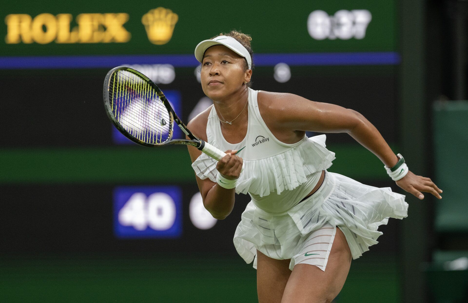 Naomi Osaka of Japan runs for the ball during her match against Emma Navarro of the United States (not shown) on day three of The Championships at All England Lawn Tennis and Croquet Club.