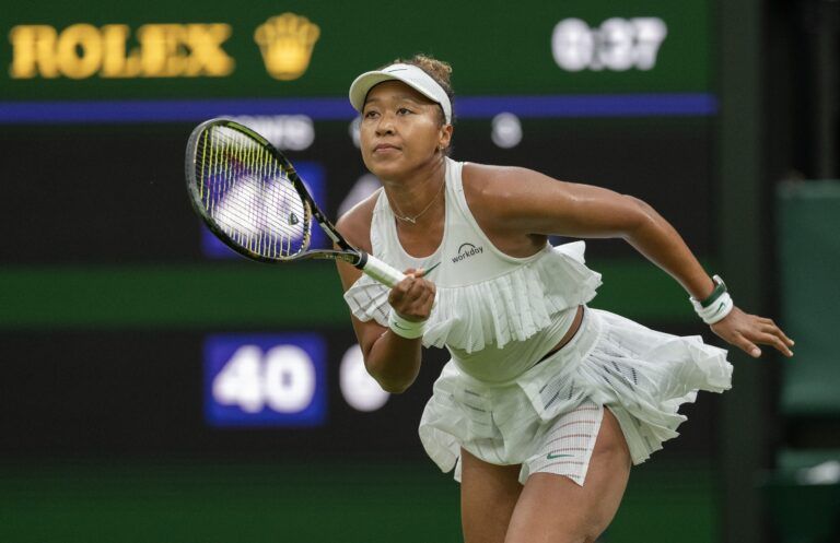 Naomi Osaka of Japan runs for the ball during her match against Emma Navarro of the United States (not shown) on day three of The Championships at All England Lawn Tennis and Croquet Club.