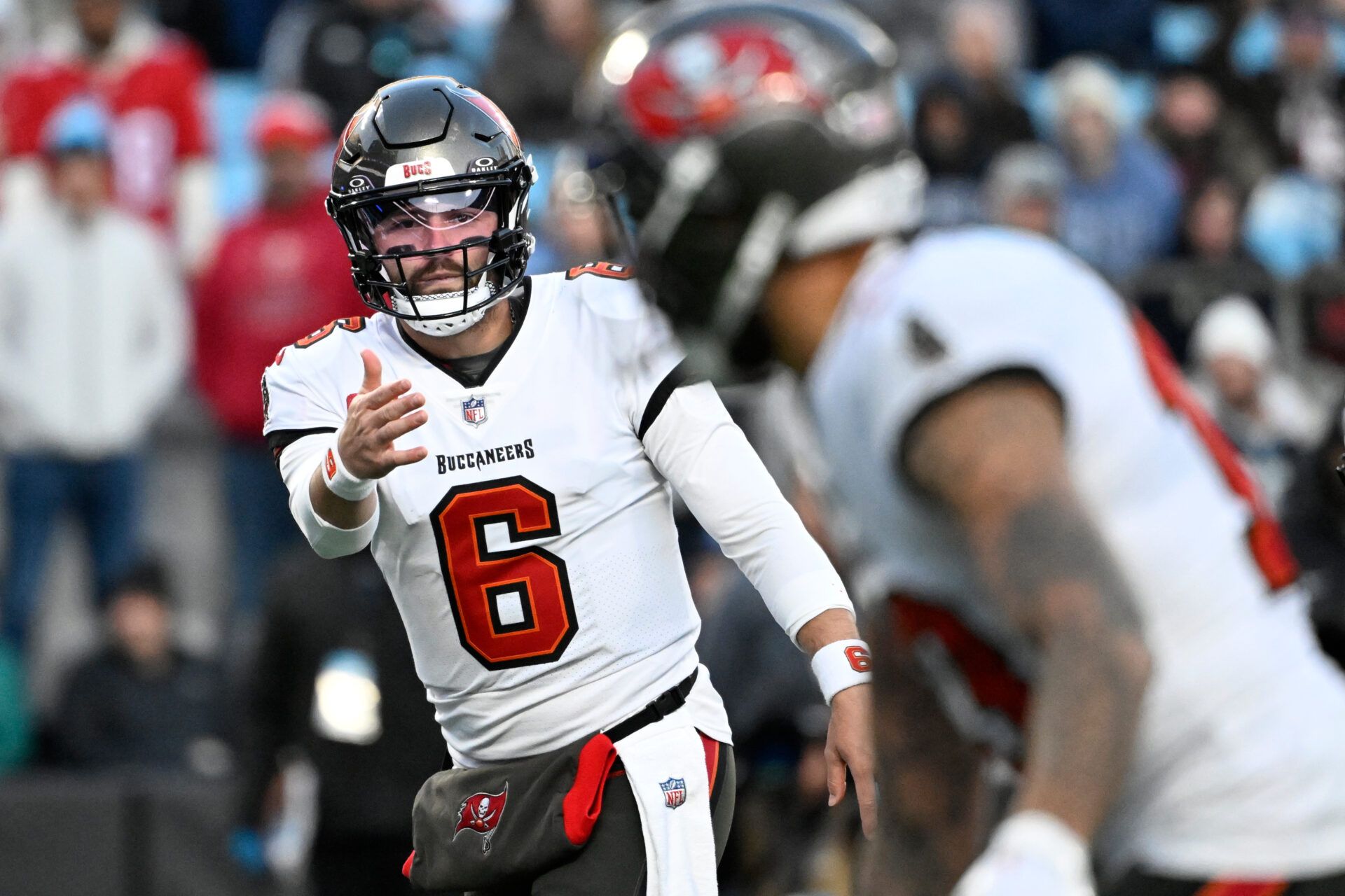 Tampa Bay Buccaneers quarterback Baker Mayfield (6) signals to wide receiver Mike Evans (13) in the first quarter at Bank of America Stadium.