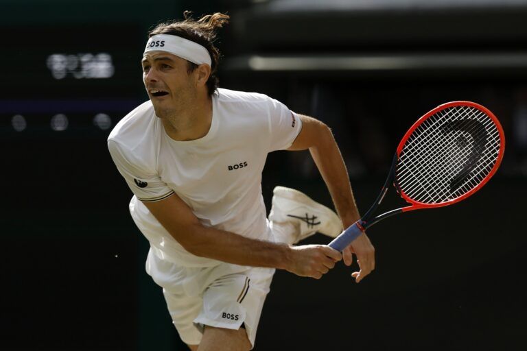 Taylor Fritz (USA) serves against Lorenzo Musetti (ITA)(not pictured) in a gentlemen's singles quarter final match of The Championships Wimbledon 2024 at The All England Lawn Tennis Club.