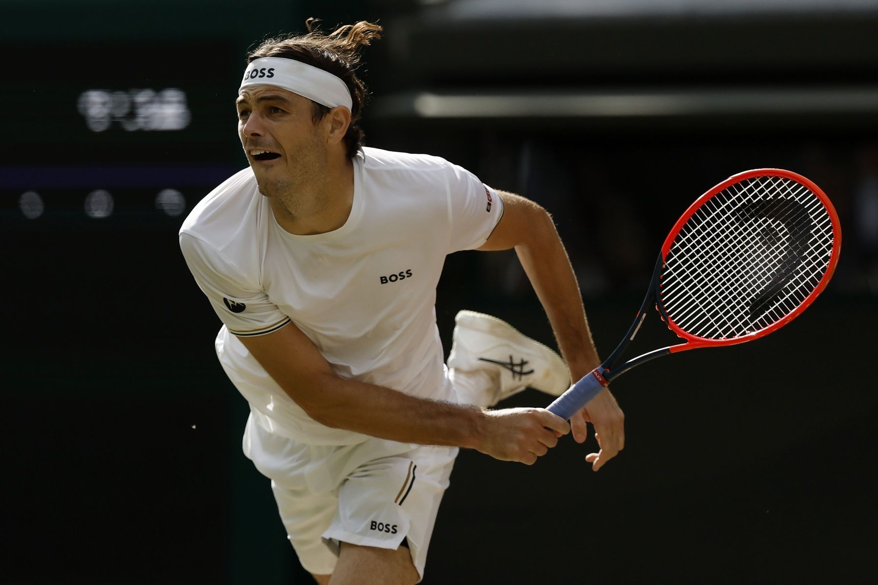 Taylor Fritz (USA) serves against Lorenzo Musetti (ITA)(not pictured) in a gentlemen's singles quarter final match of The Championships Wimbledon 2024 at The All England Lawn Tennis Club.