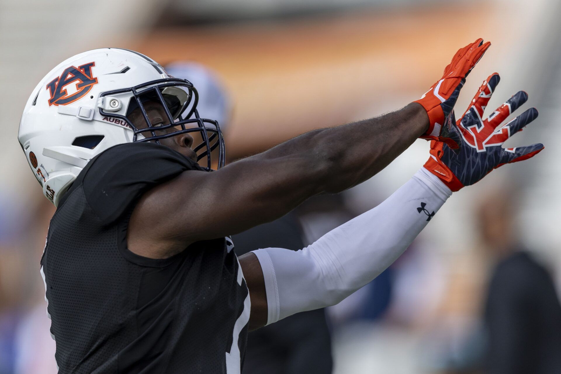American team linebacker Eugene Asante of Auburn (7) works through drills during Senior Bowl practice for the American team at Hancock Whitney Stadium.