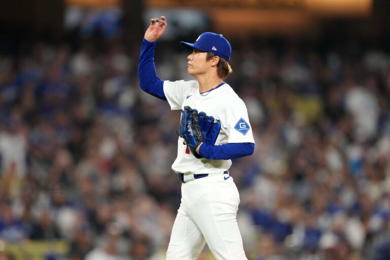 Los Angeles Dodgers starting pitcher Yoshinobu Yamamoto (18) reacts in the sixth inning against the Chicago White Sox at Dodger Stadium.
