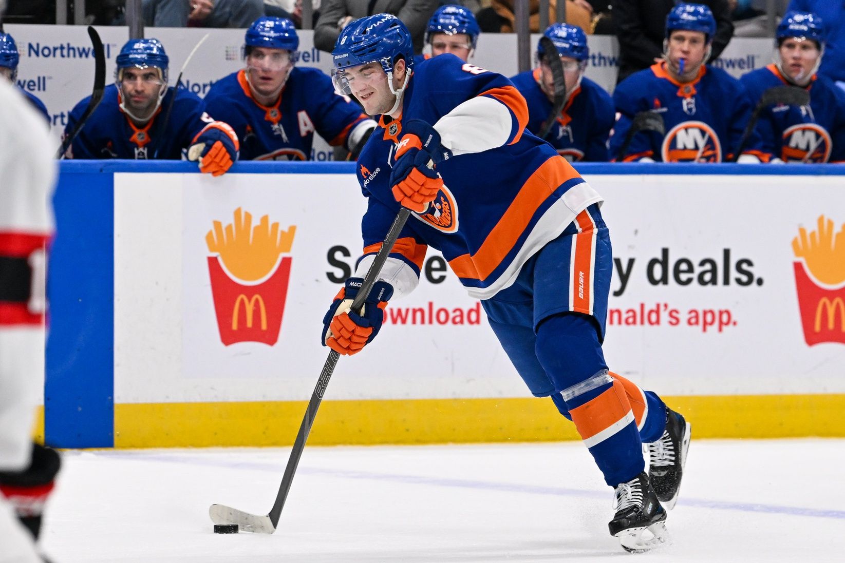 New York Islanders defenseman Noah Dobson (8) attempts a shot against the Ottawa Senators during the second period at UBS Arena.