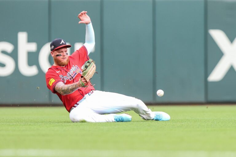 Atlanta Braves outfielder Alex Verdugo (8) makes an error in the field against the Colorado Rockies during the second inning at Truist Park.