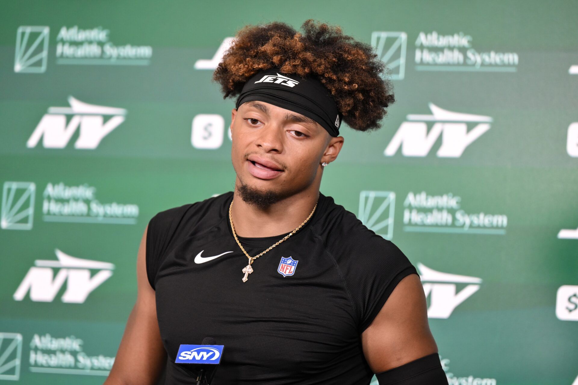 New York Jets quarterback Justin Fields (7) speaks at a press conference during minicamp at Atlantic Health Jets Training Center.