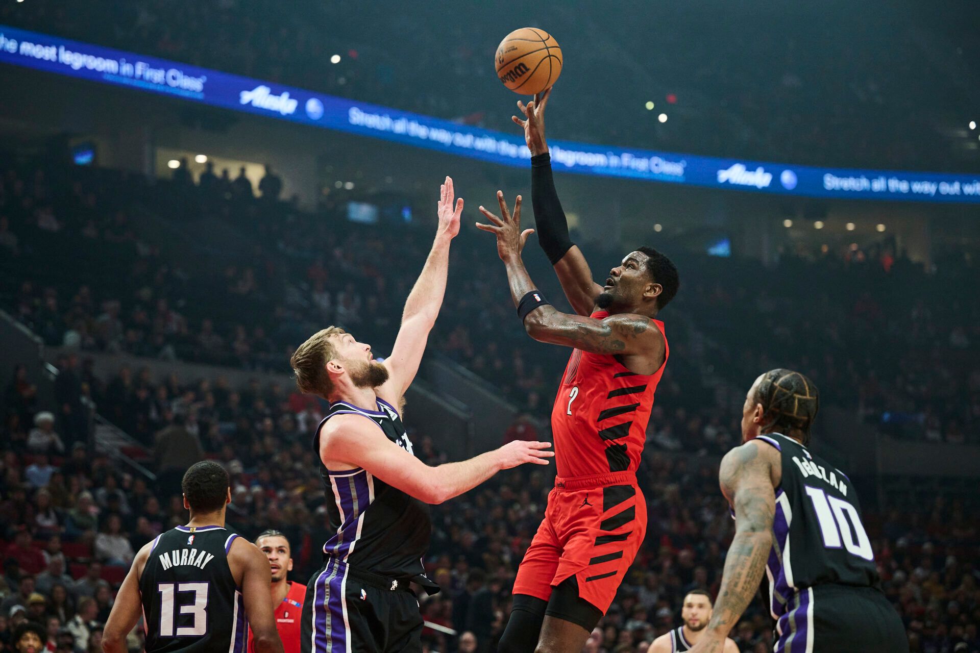 Portland Trail Blazers center Deandre Ayton (2) shoots a jump shot the ball during the first half against Sacramento Kings forward Domantas Sabonis (11) at Moda Center.
