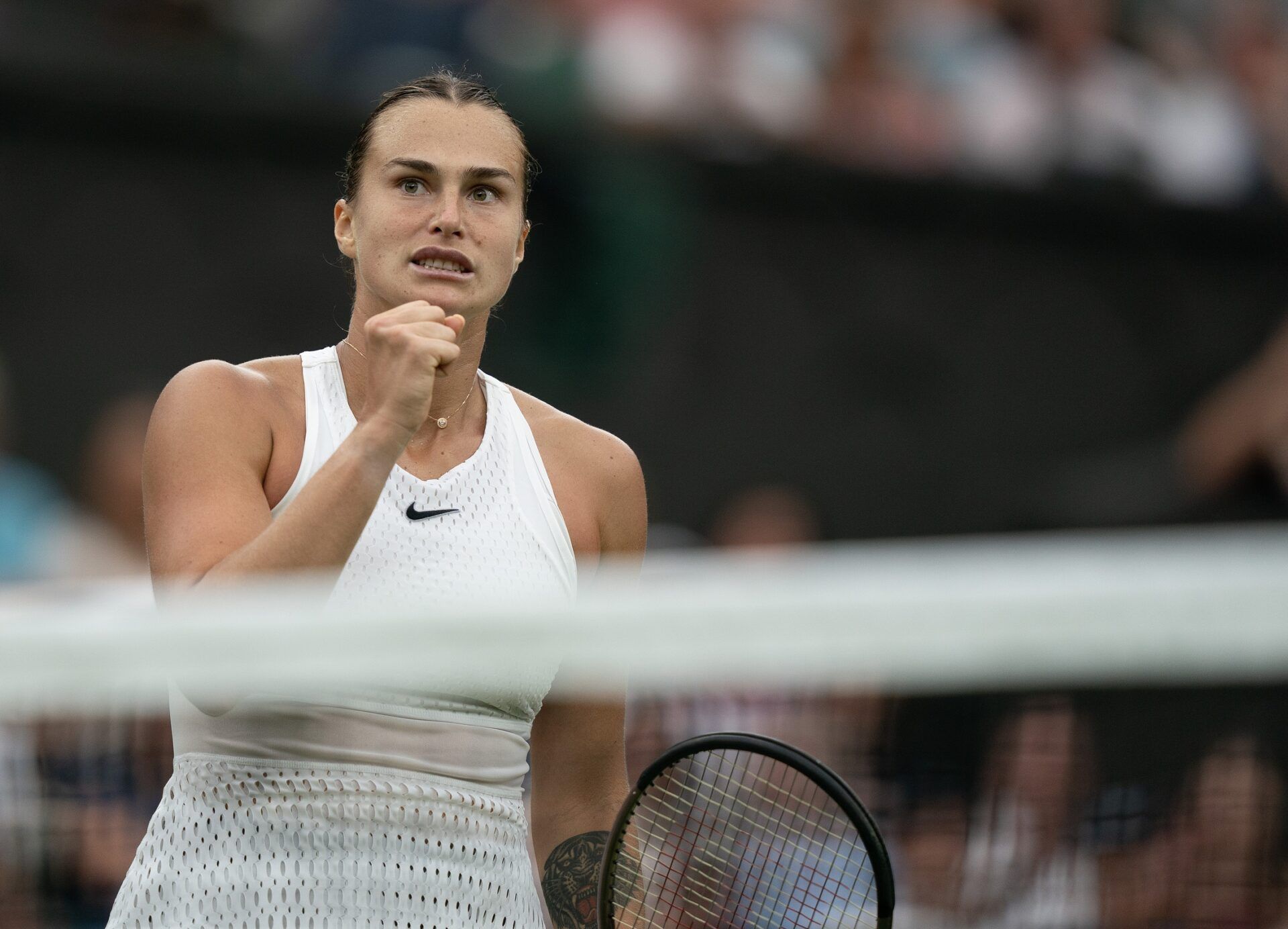 Aryna Sabalenka reacts to a point during her match against Aryna Sabalenka on day 11 at the All England Lawn Tennis and Croquet Club.