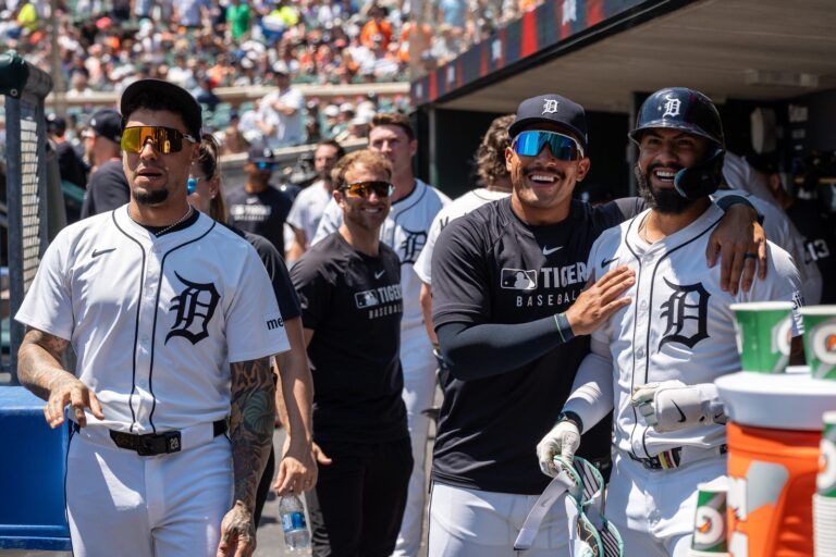 Detroit Tigers Javier Báez, left, Jahmai Jones, middle, and Gleyber Torres look up at the video board to watch Torres’ home run against the Twins at Comerica Park in Detroit on Saturday, June 28, 2025.