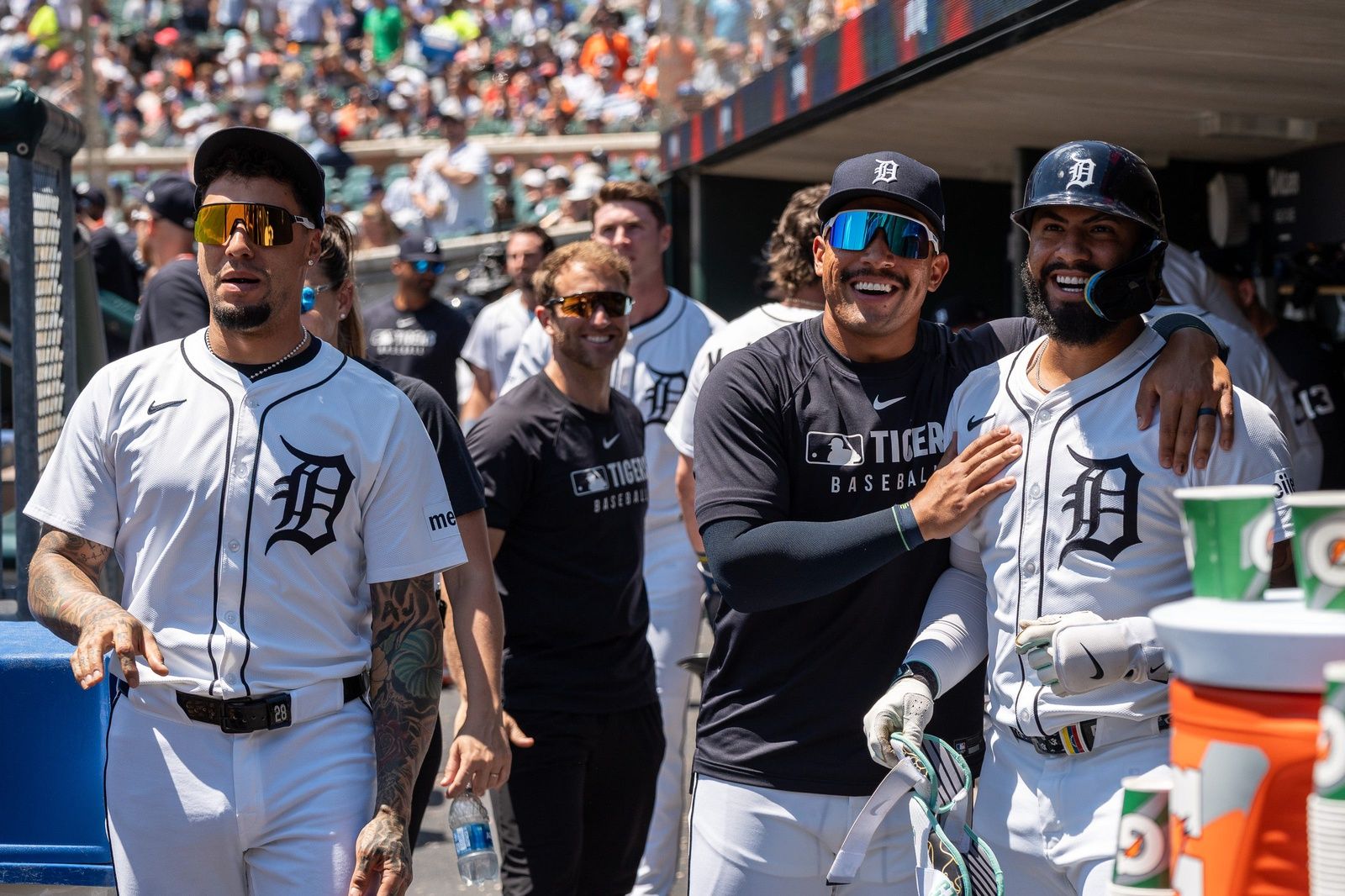 Detroit Tigers Javier Báez, left, Jahmai Jones, middle, and Gleyber Torres look up at the video board to watch Torres’ home run against the Twins at Comerica Park in Detroit on Saturday, June 28, 2025.