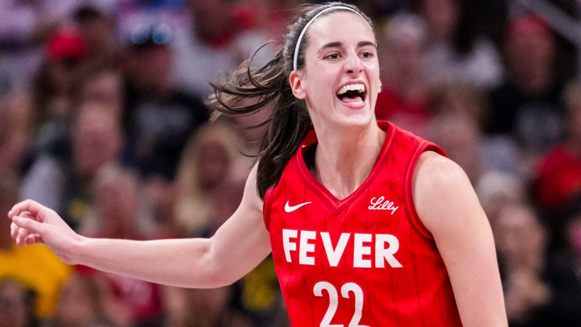 Indiana Fever guard Caitlin Clark (22) reacts after shooting a 3-pointer Friday, Aug. 16, 2024, during the game at Gainbridge Fieldhouse in Indianapolis.
