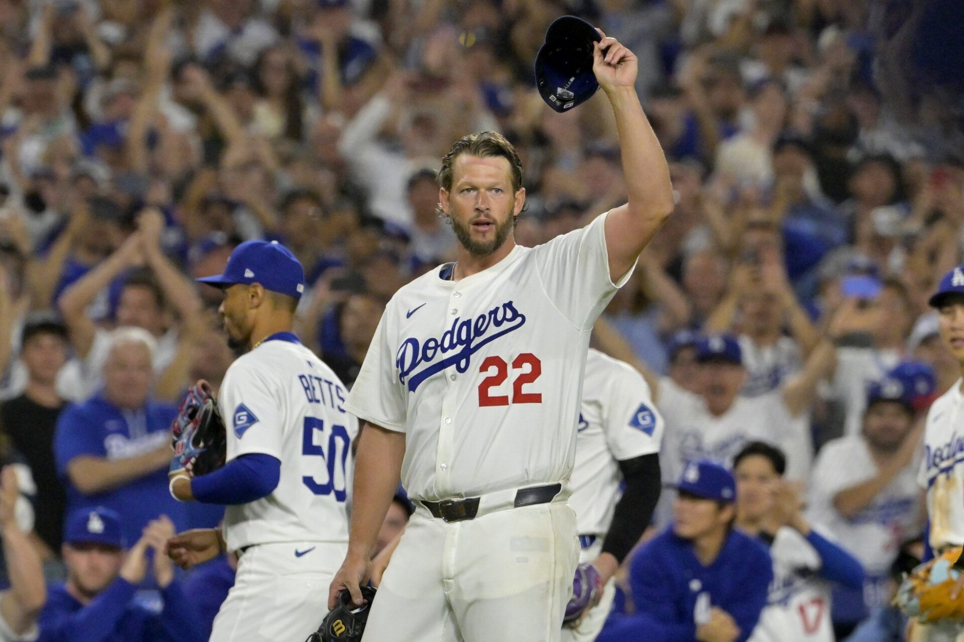 Los Angeles Dodgers starting pitcher Clayton Kershaw (22) acknowledges the crowd after striking out Chicago White Sox third baseman Vinny Capra (41) for his 3000th career strike in the fifth inning at Dodger Stadium.