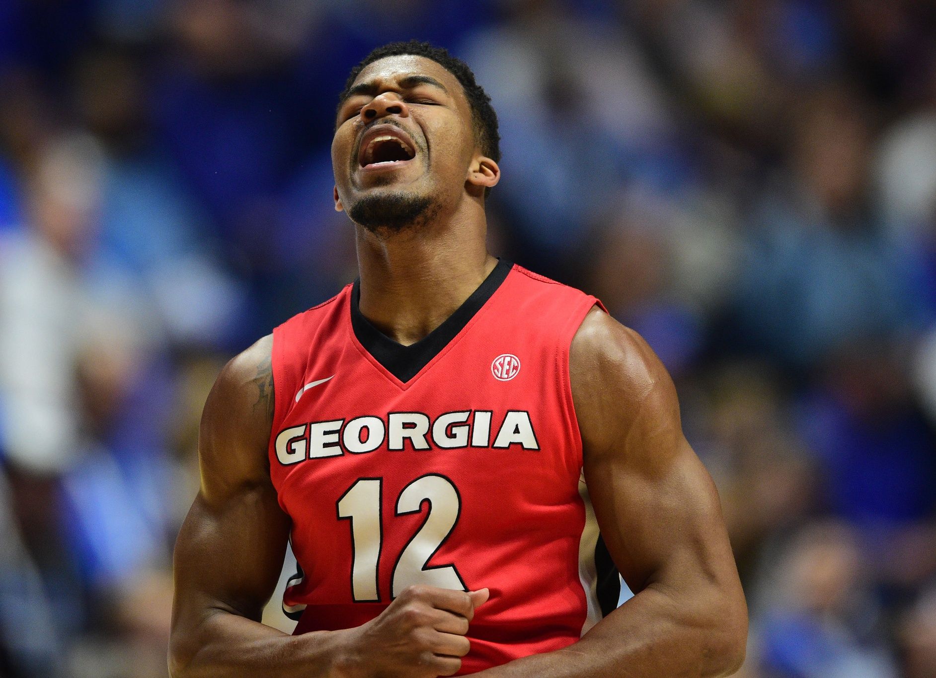 Georgia Bulldogs guard Kenny Gaines (12) celebrates after scoring in the first half against the Kentucky Wildcats during the SEC conference tournament at Bridgestone Arena.