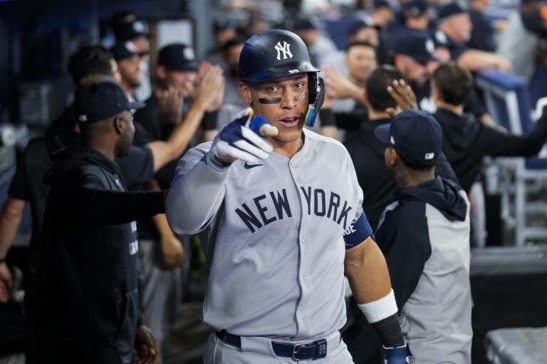 New York Yankees outfielder Aaron Judge (99) celebrates after hitting a home run during the eighth inning in their MLB game against the Toronto Blue Jays at Rogers Centre.