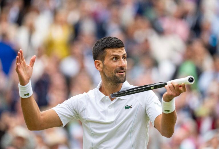 Novak Djokovic of Serbia celebrates winning his match against Lorenzo Musetti of Italy on day 12 at All England Lawn Tennis and Croquet Club.
