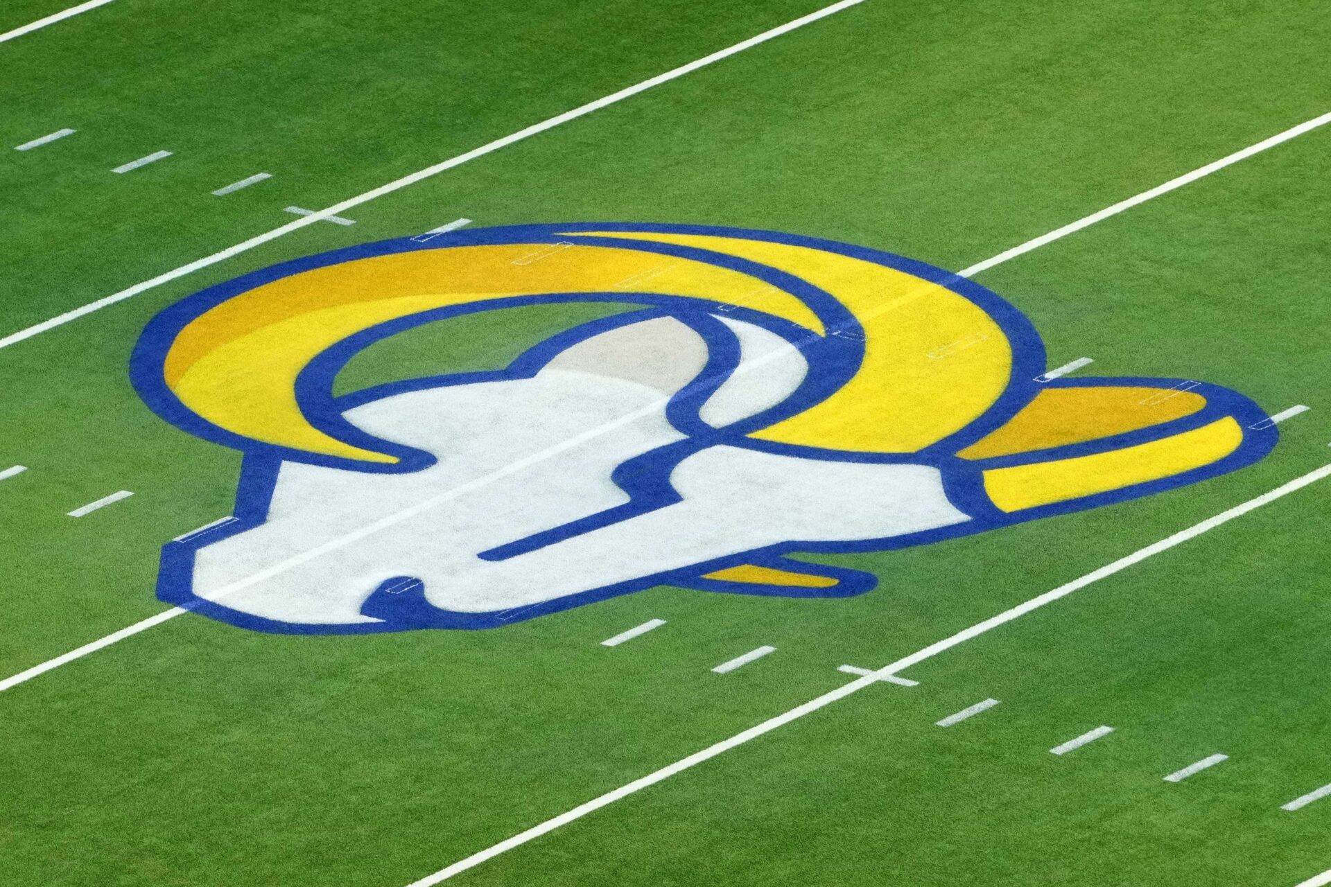 The Los Angeles Rams logo at midfield at SoFi Stadium.