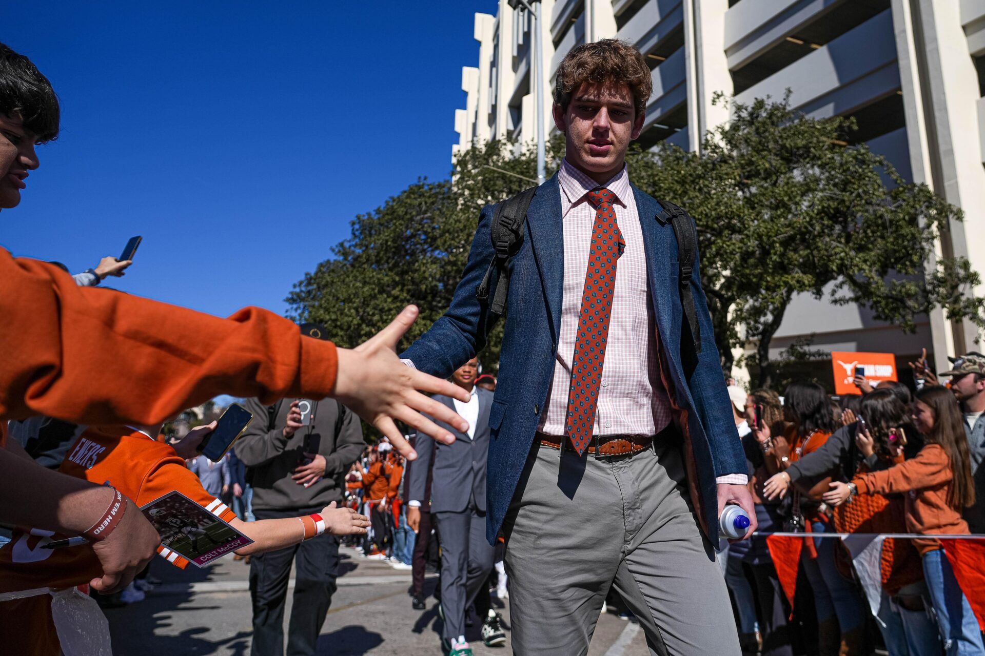 Texas Longhorns quarterback Arch Manning (16) is greeted by fans ahead of the game against Clemson in the first round of the College Football Playoffs at Darrell K Royal-Texas Memorial Stadium on Saturday, Dec. 21, 2024.