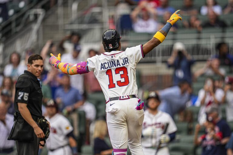 Atlanta Braves right fielder Ronald Acuna Jr (13) reacts after hitting a lead off home run against the New York Mets during the first inning at Truist Park.