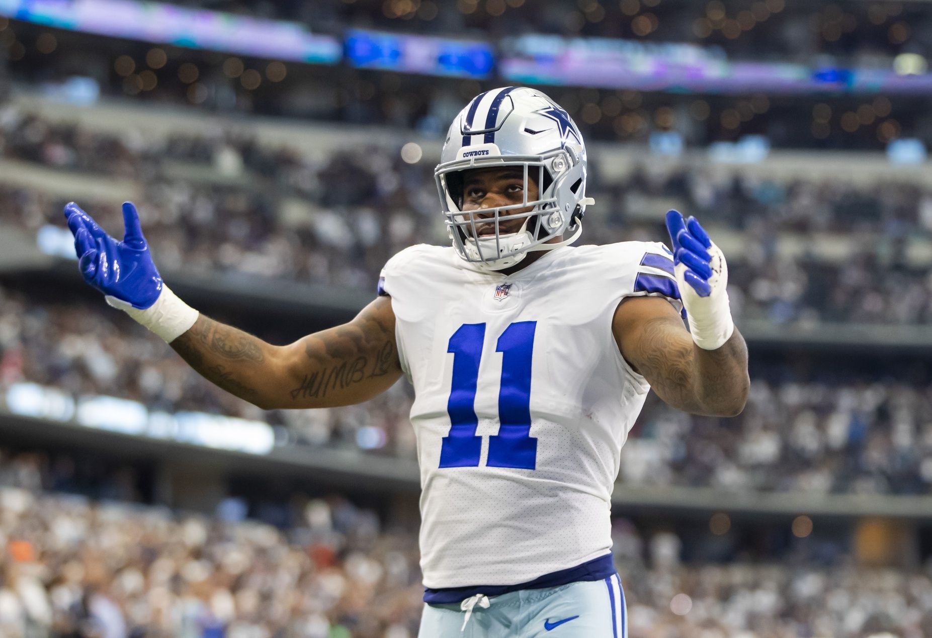 Dallas Cowboys  linebacker Micah Parsons (11) reacts against the Carolina Panthers at AT&T Stadium.