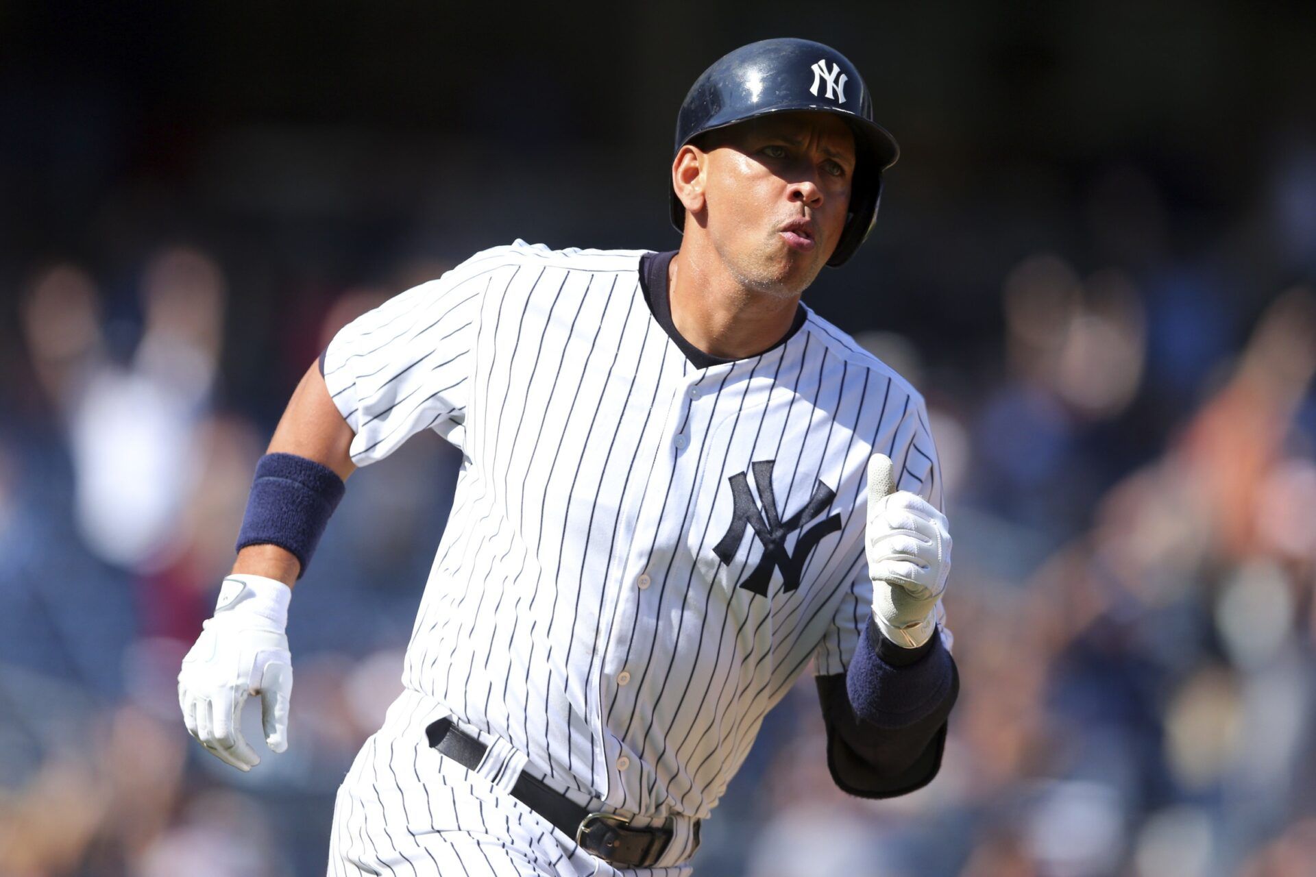New York Yankees designated hitter Alex Rodriguez (13) runs the bases after hitting a solo home run against the Baltimore Orioles during the fifth inning at Yankee Stadium.