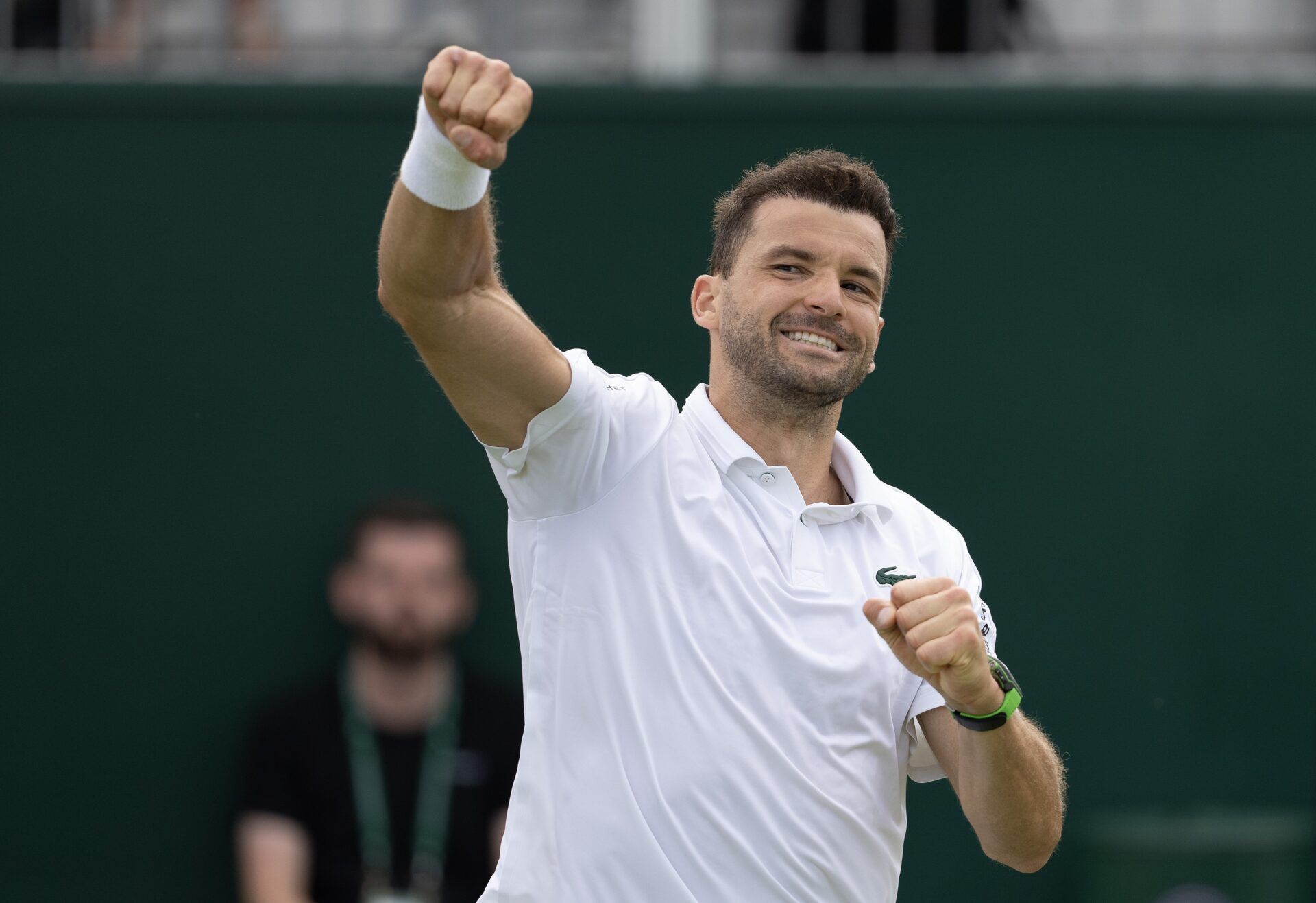 Grigor Dimitrov of Bulgaria celebrates winning his match against Juncheng Shang of China (not shown) on day four of The Championships at All England Lawn Tennis and Croquet Club.