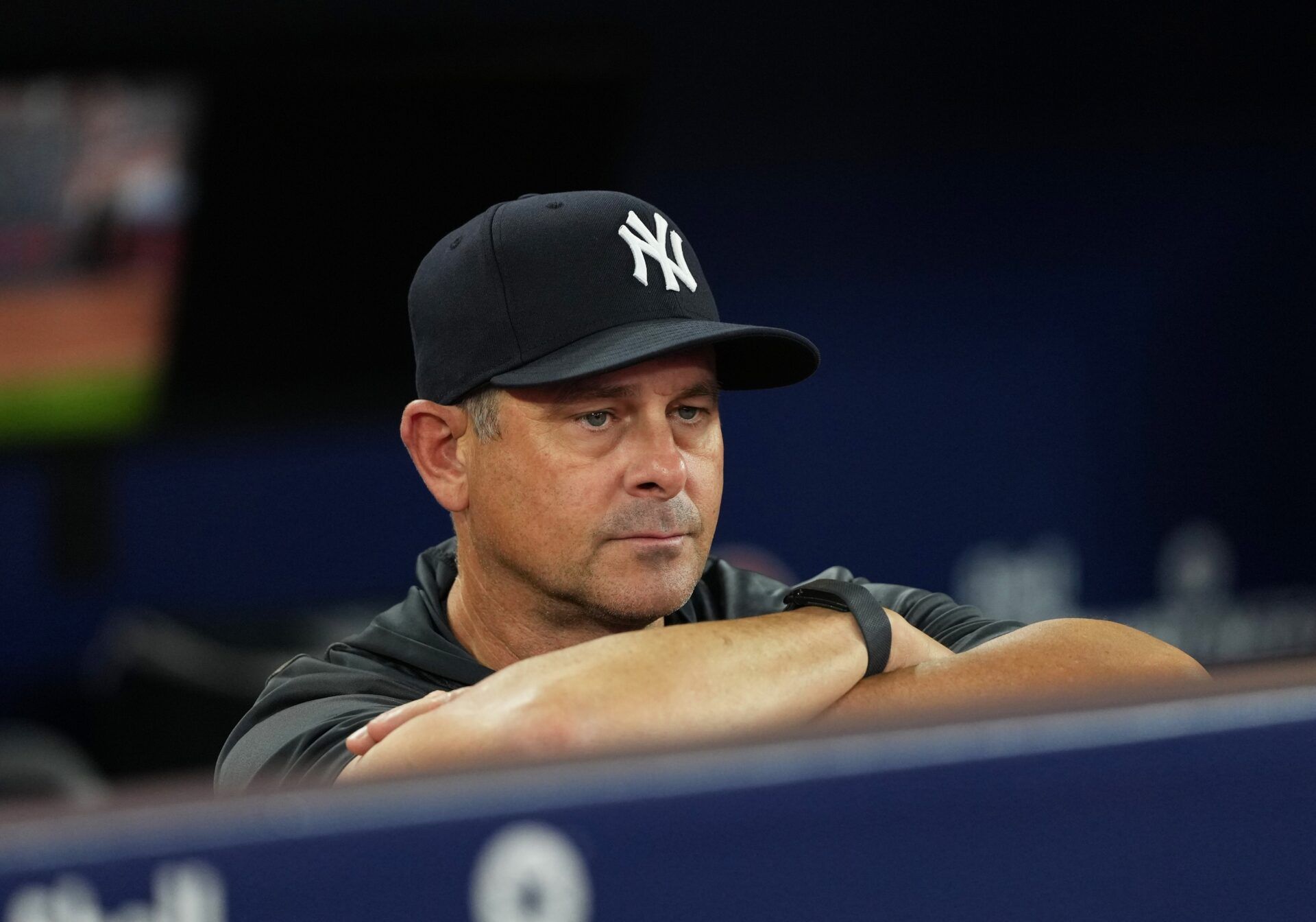 New York Yankees manager Aaron Boone (17) watches batting practice before a game against the Toronto Blue Jays at Rogers Centre.