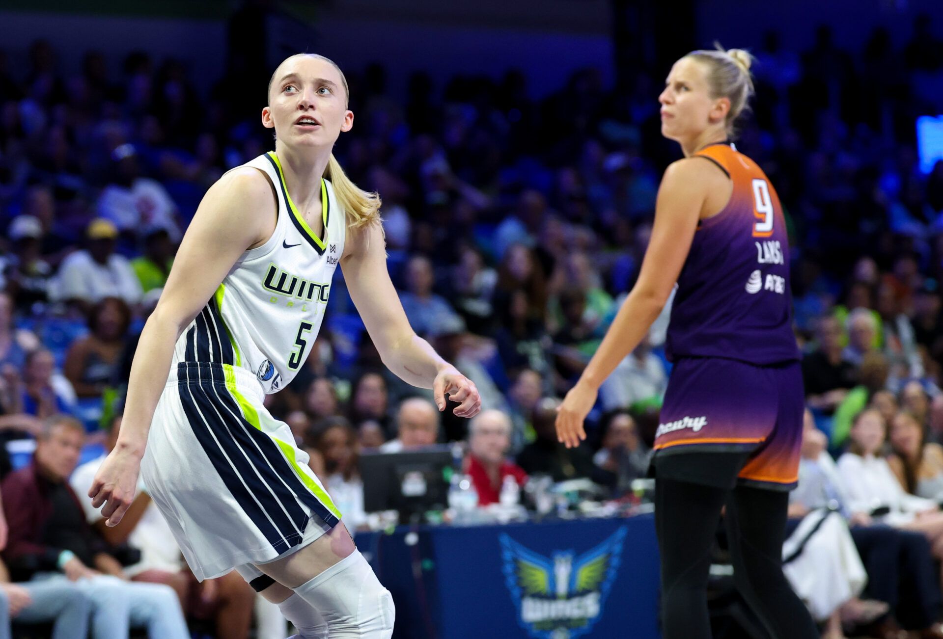 Dallas Wings guard Paige Bueckers (5) reacts after scoring in front of Phoenix Mercury guard Kitija Laksa (9) during the first half at College Park Center.