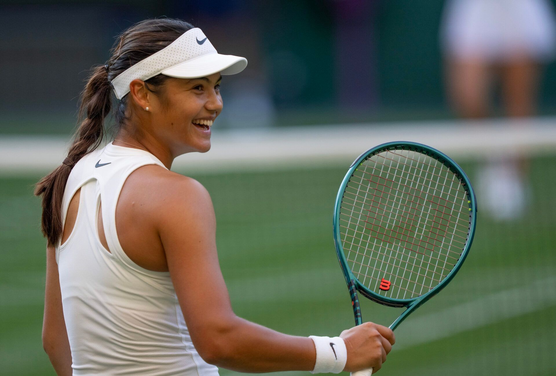 Emma Raducanu of Great Britain celebrates winning her match against Marketa Vondrousova of the Czech Republic on day three at the All England Lawn Tennis and Croquet Club.
