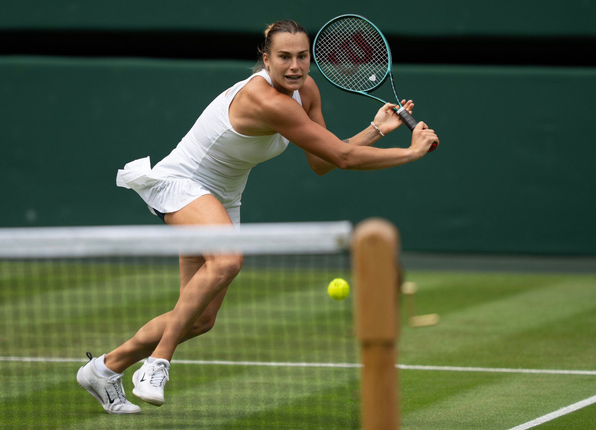 Aryna Sabalenka returns a shot during her match against Marie Bouzkova of the Czech Republic on day three at the All England Lawn Tennis and Croquet Club.