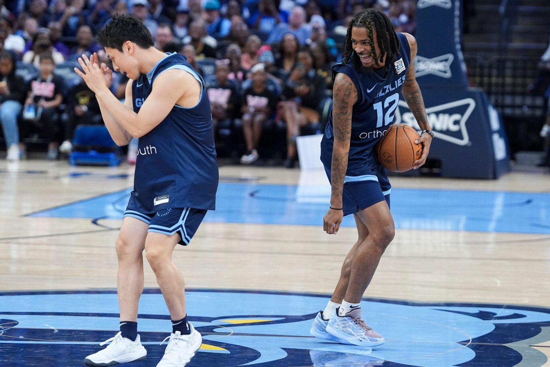 Grizzlies' Yuki Kawamura (17) and Ja Morant (12) do the griddy dance during open practice at FedExForum in Memphis, Tenn., on Sunday, October 6, 2024.