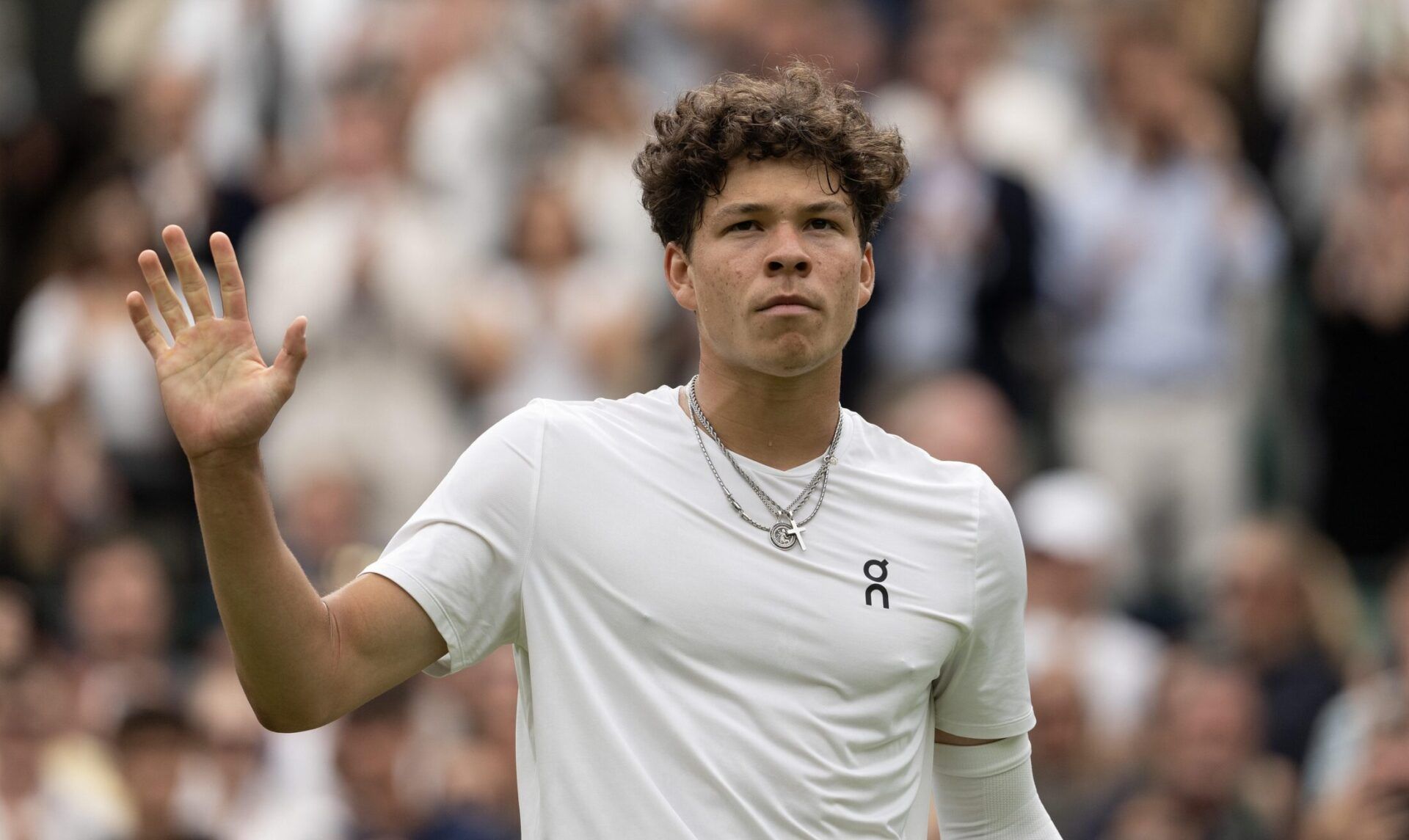 Ben Shelton of the United States gestures after a shot during his match against Denis Shapovalov (not shown) of Canada on day six of The Championships at All England Lawn Tennis and Croquet Club.