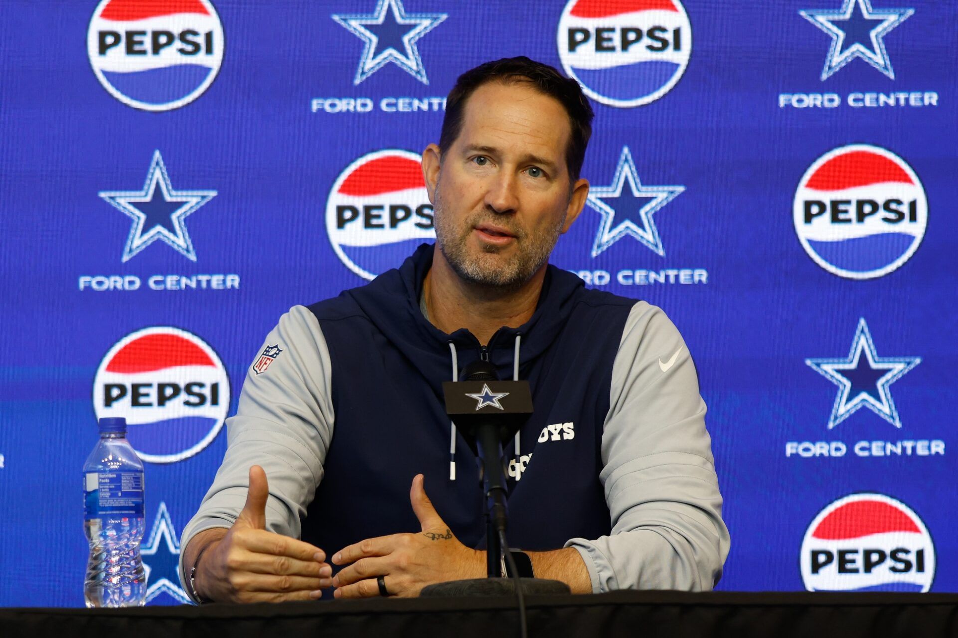 Dallas Cowboys head coach Brian Schottenheimer addresses the media before practice at the Ford Center at the Star Training Facility in Frisco, Texas.