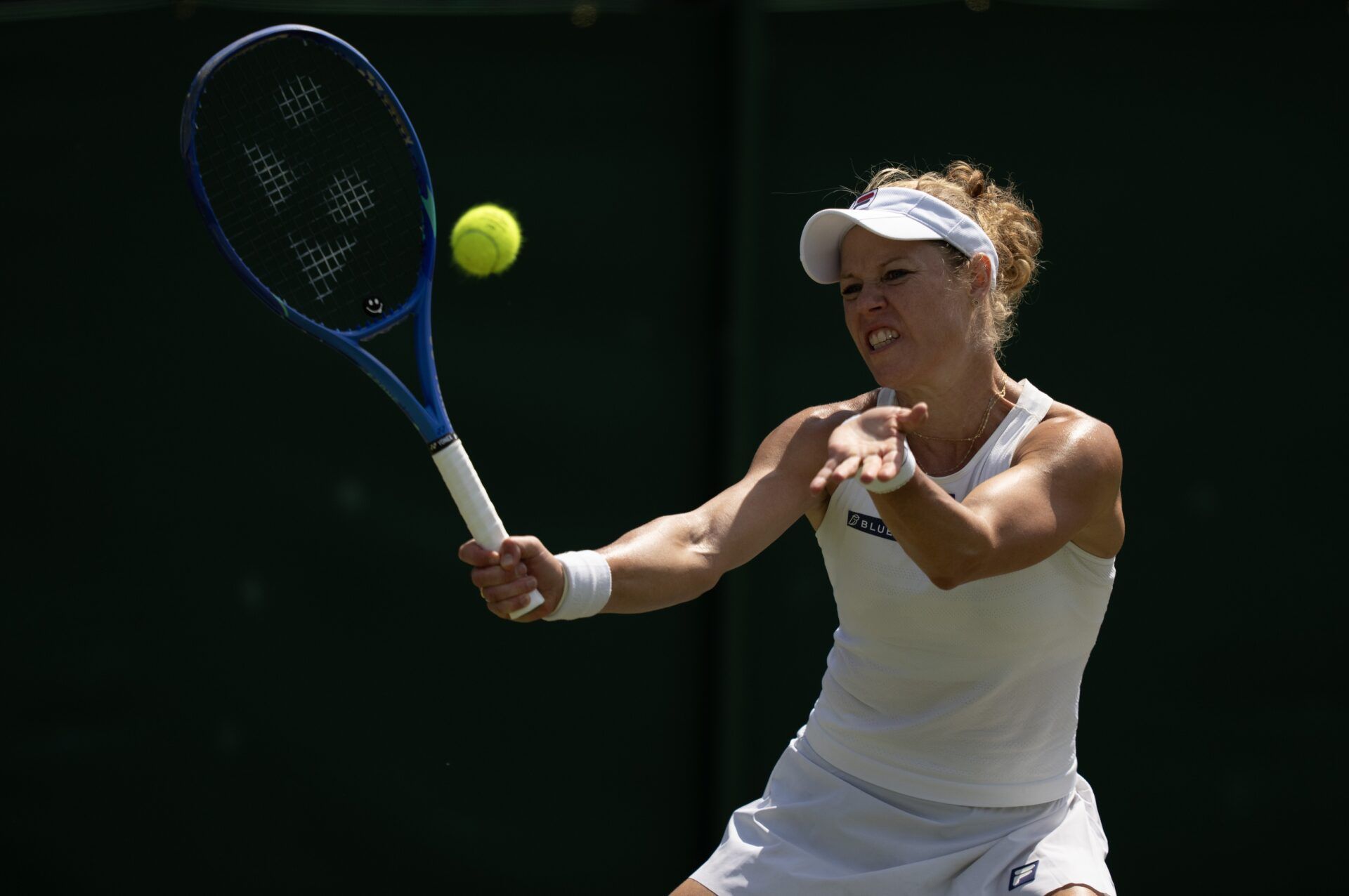 Laura Siegemund of Germany returns a shot during her match against Madison Keys of the United States on day five at the All England Lawn Tennis and Croquet Club.