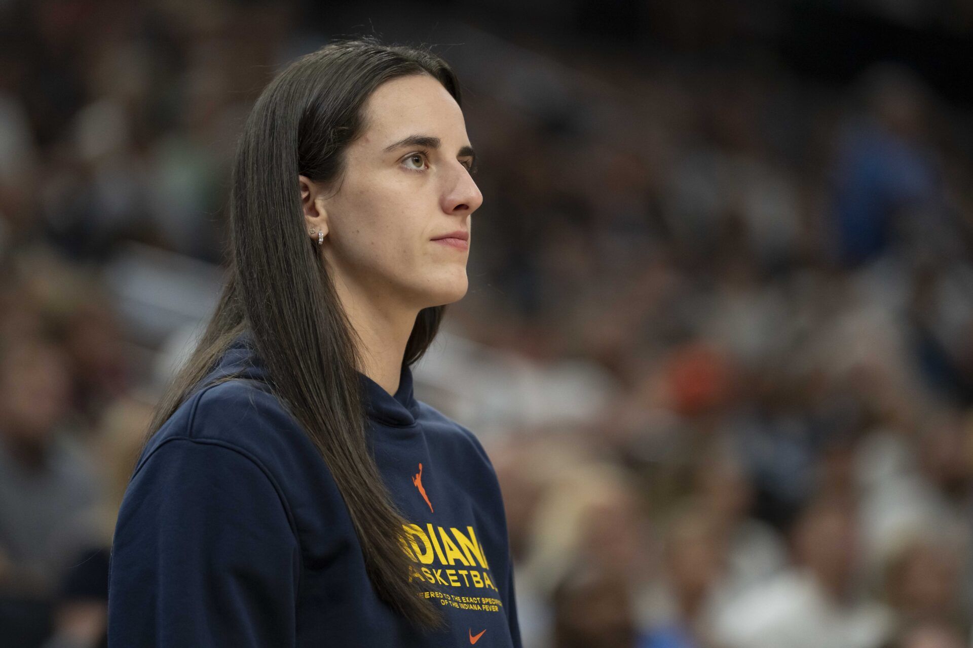 Indiana Fever guard Caitlin Clark (22) looks on against the Minnesota Lynx in the second half during the Commissioner's Cup final at Target Center.