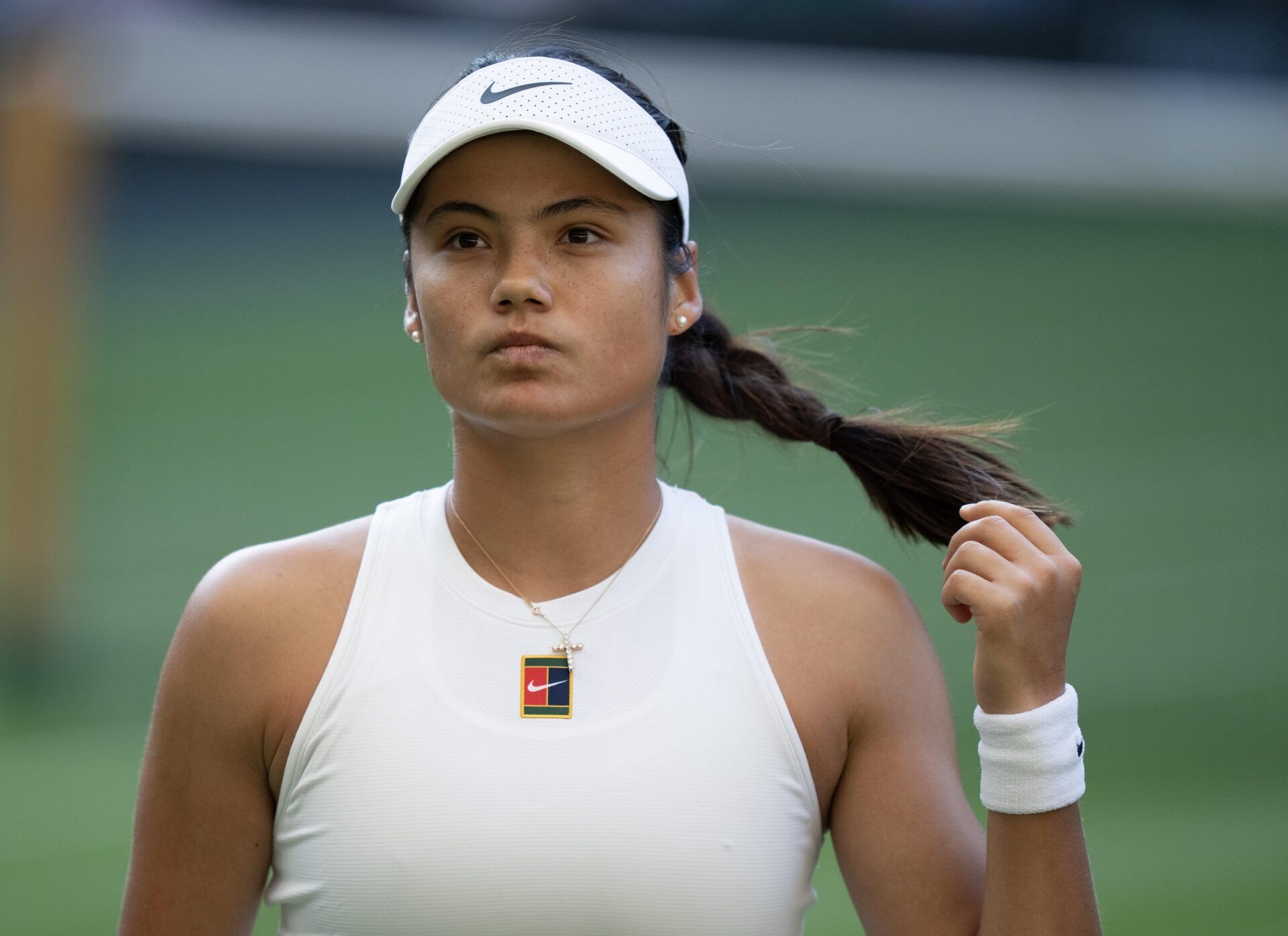 Emma Raducanu of Great Britain during her match against Marketa Vondrousova of the Czech Republic on day three at the All England Lawn Tennis and Croquet Club.