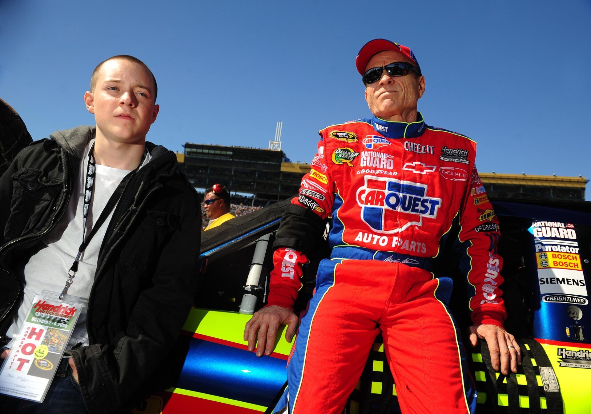 Oct. 4, 2009; Kansas City, KS, USA; NASCAR Sprint Cup Series driver Mark Martin (right) with son Matt Martin prior to the Price Chopper 400 at Kansas Speedway.