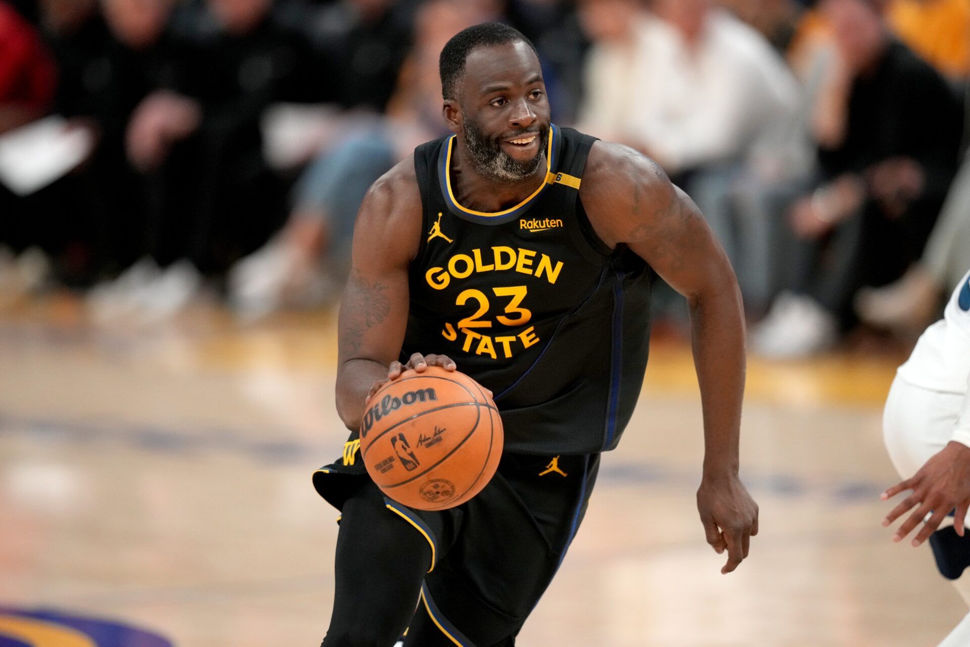 Golden State Warriors forward Draymond Green (23) dribbles the ball against the Minnesota Timberwolves in the fourth quarter during game four of the second round for the 2025 NBA Playoffs at Chase Center.