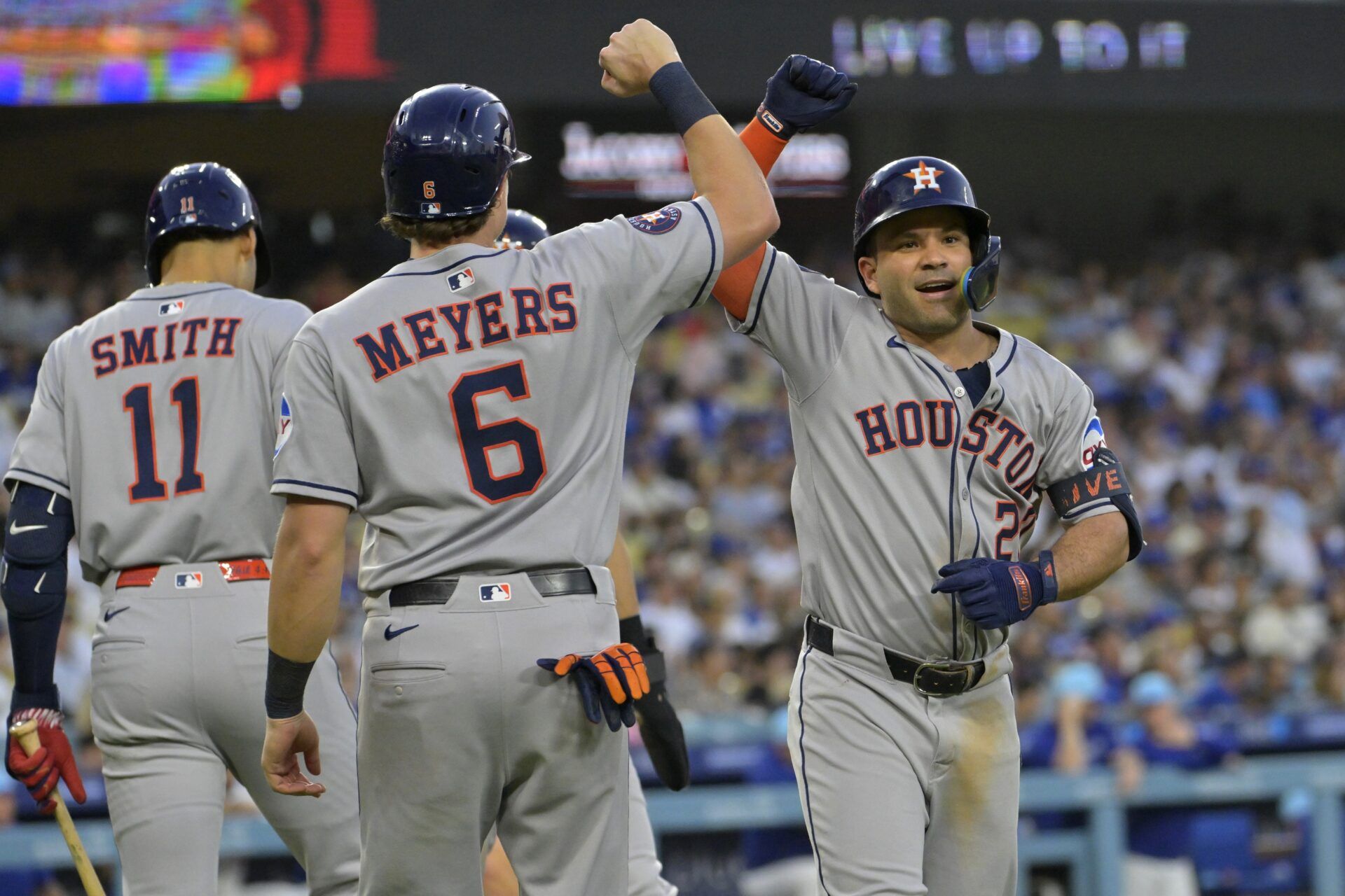 Houston Astros left fielder Jose Altuve (27) is congratulated by center fielder Jake Meyers (6) after hitting a three-run home run in the sixth inning against the Los Angeles Dodgers at Dodger Stadium.