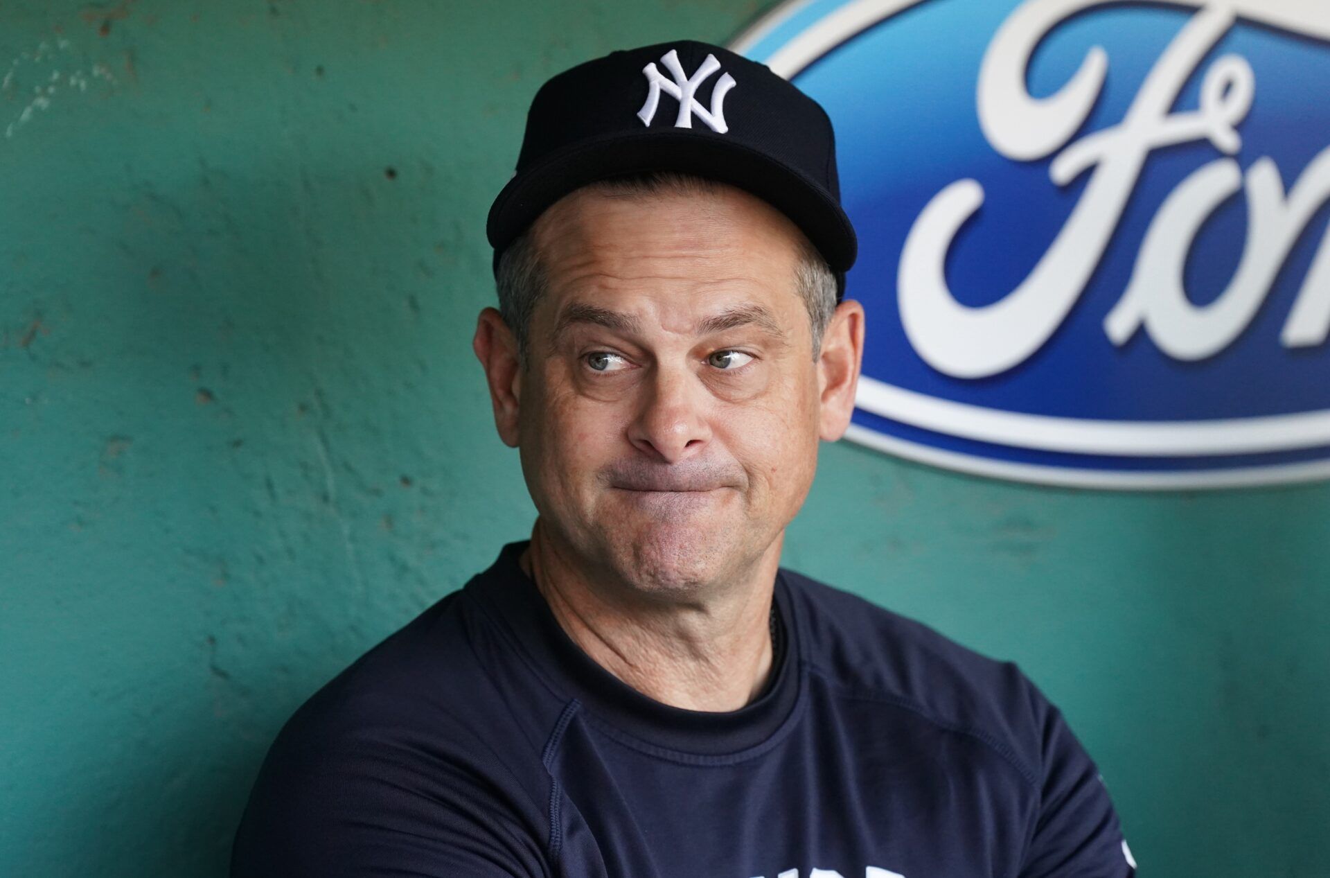 New York Yankees manager Aaron Boone (17) in the dugout before the start of the game against the Boston Red Sox at Fenway Park.